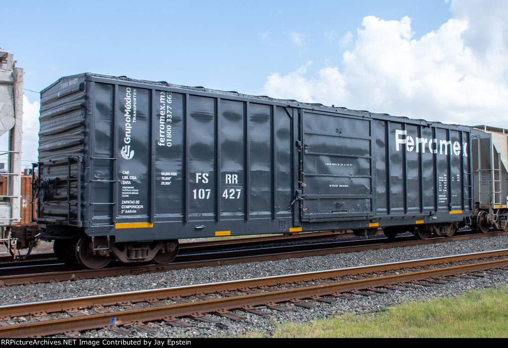 A Shiny Ferromex Boxcar trails on eastbound KCS Train 